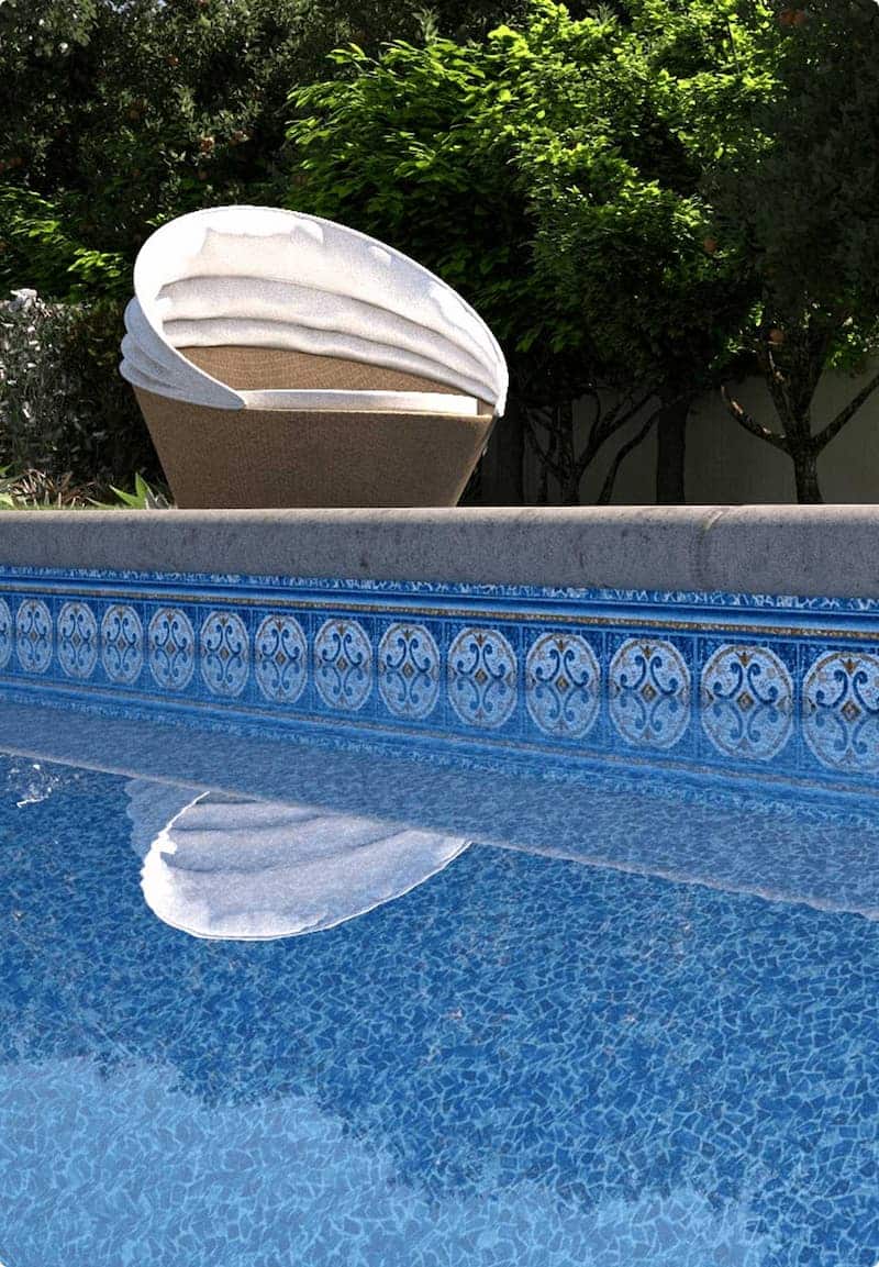 Close up of a vinyl liner in a residential inground pool with clear water
