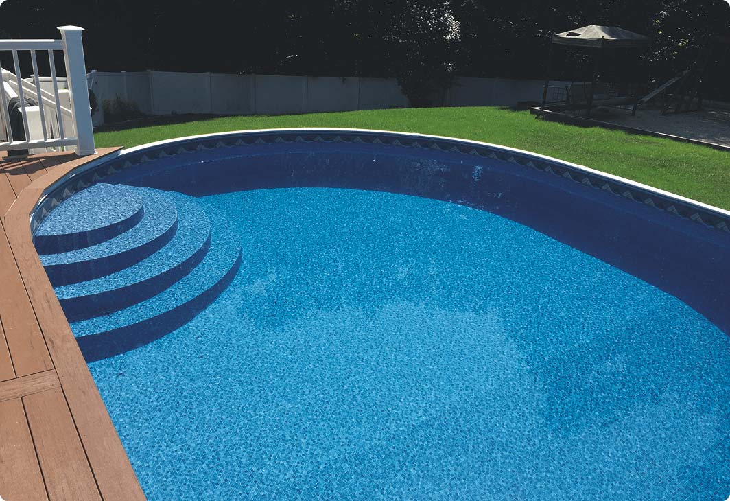Above ground pool with blue liner and built in-steps.
