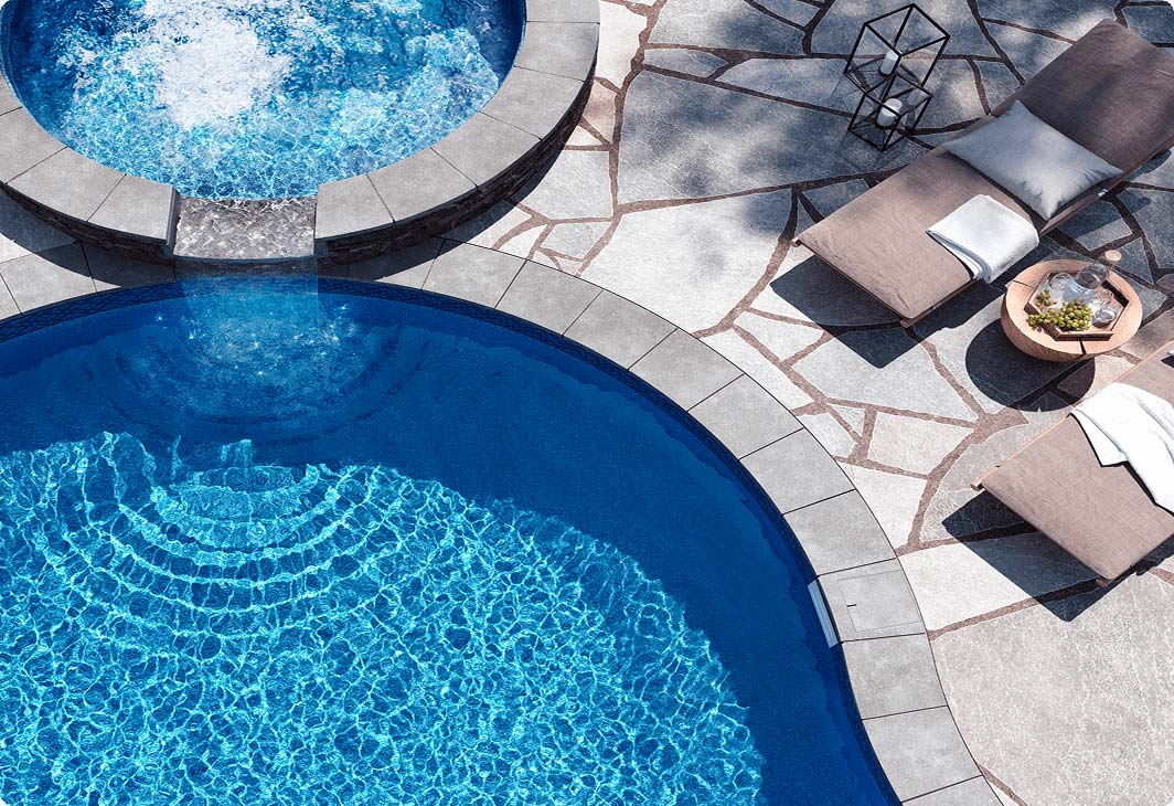 Overview of spa overflowing into inground pool