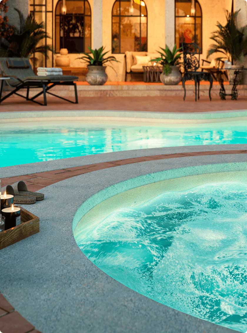 Fiberglass spa with bubbling water, set in a cozy outdoor lounge space.