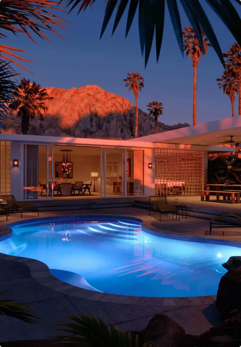 Inground pool at night featuring LED lighting.