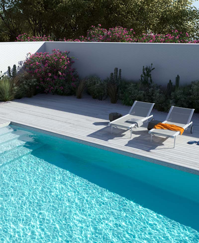 White inground fiberglass pool with wood deck and lounge chairs