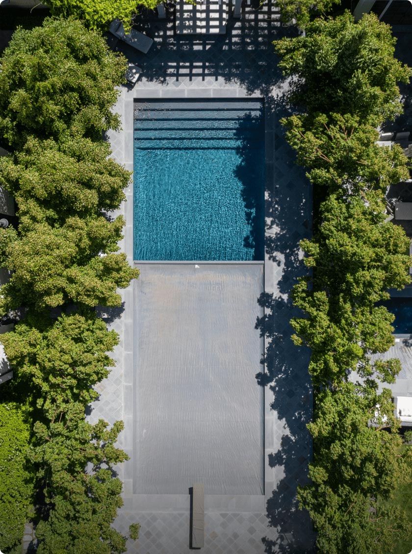 overhead view of large inground pool with automatic safety cover