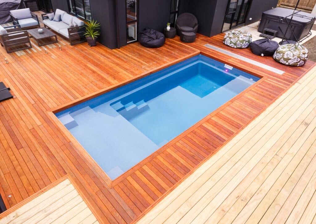 Small backyard with wood decking and plunge pool