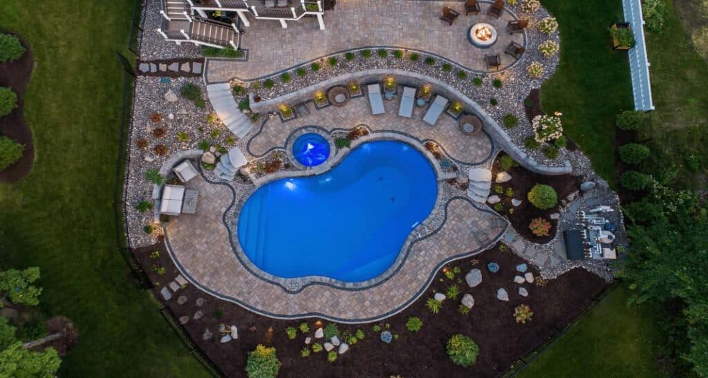 Bird's-eye view of a big backyard space with a vintage blue mosaic tile pattern.