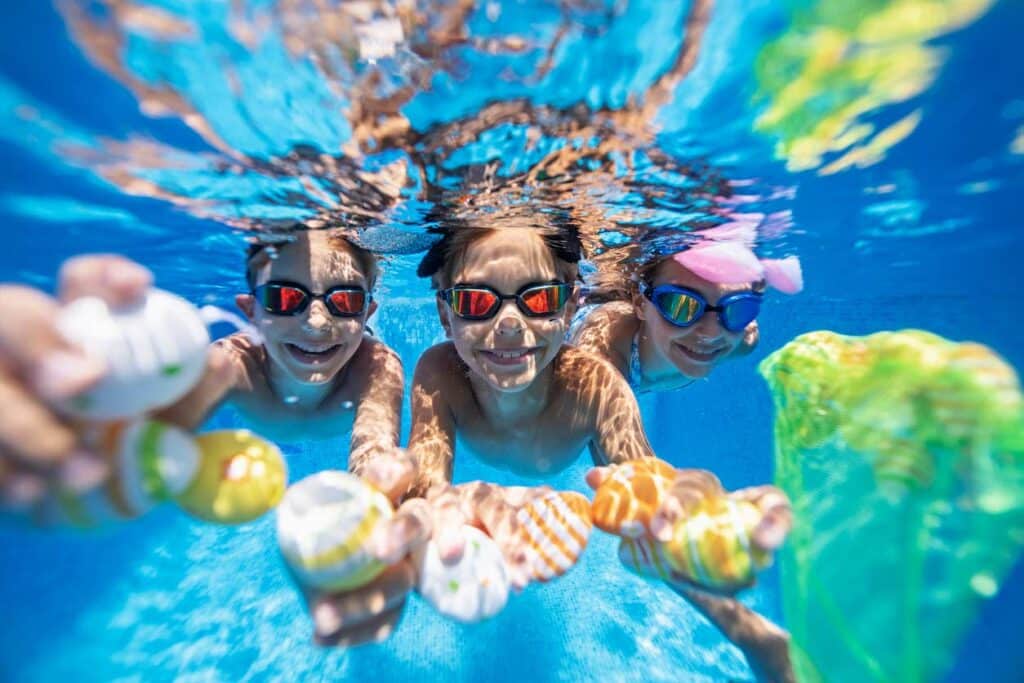 kids swimming underwater